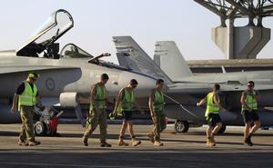 Members from No. 3 Squadron perform a foreign object check on the flight line prior to the start of flying during Exercise Bersama Shield 2012.